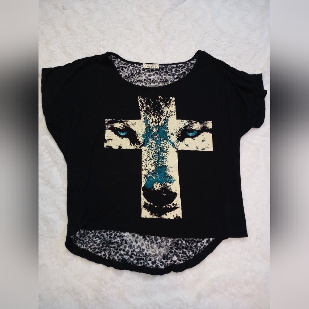 Wolf in cross shirt with ripped back